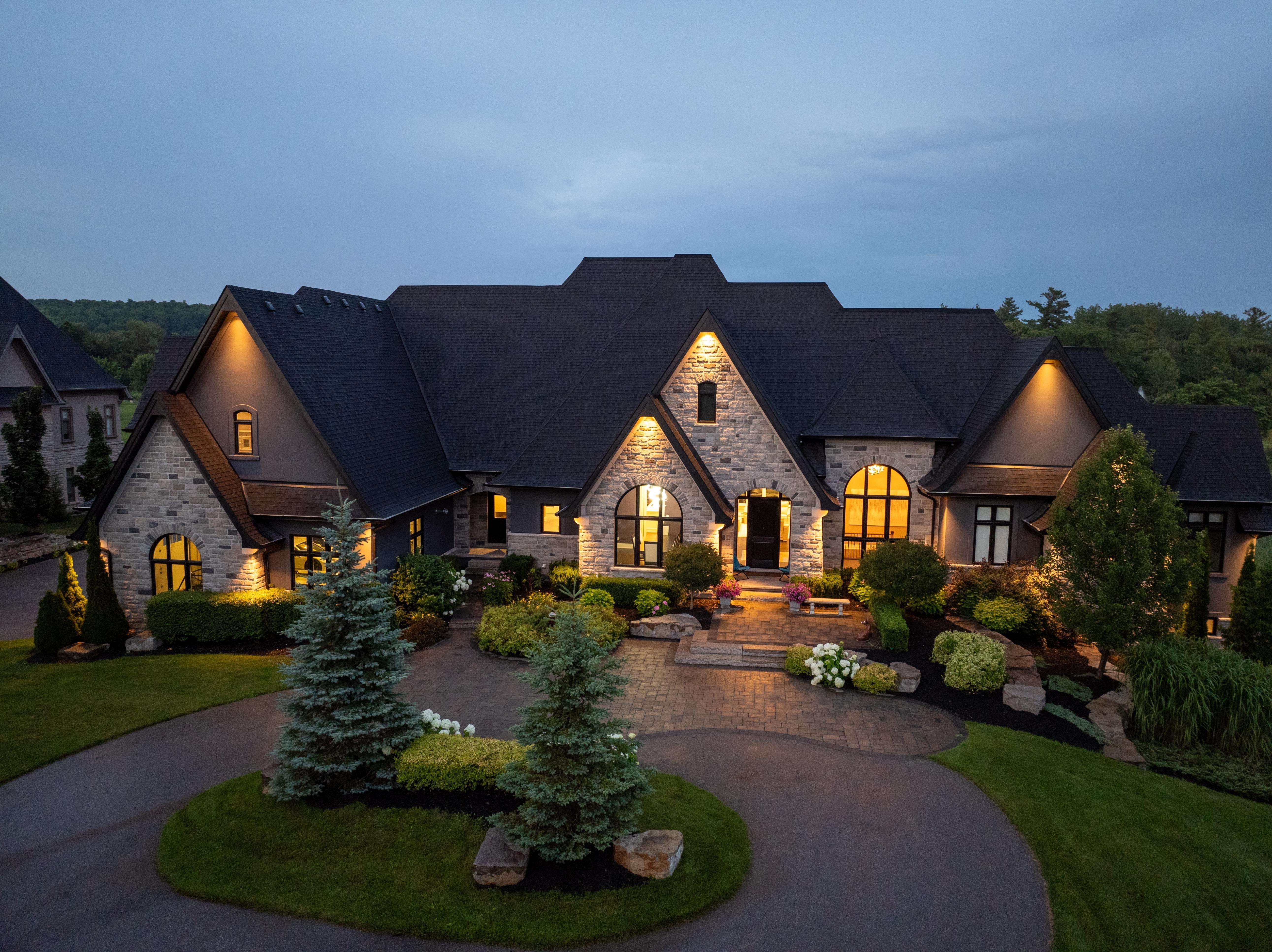 Luxury home with for sale sign showing days on market statistics